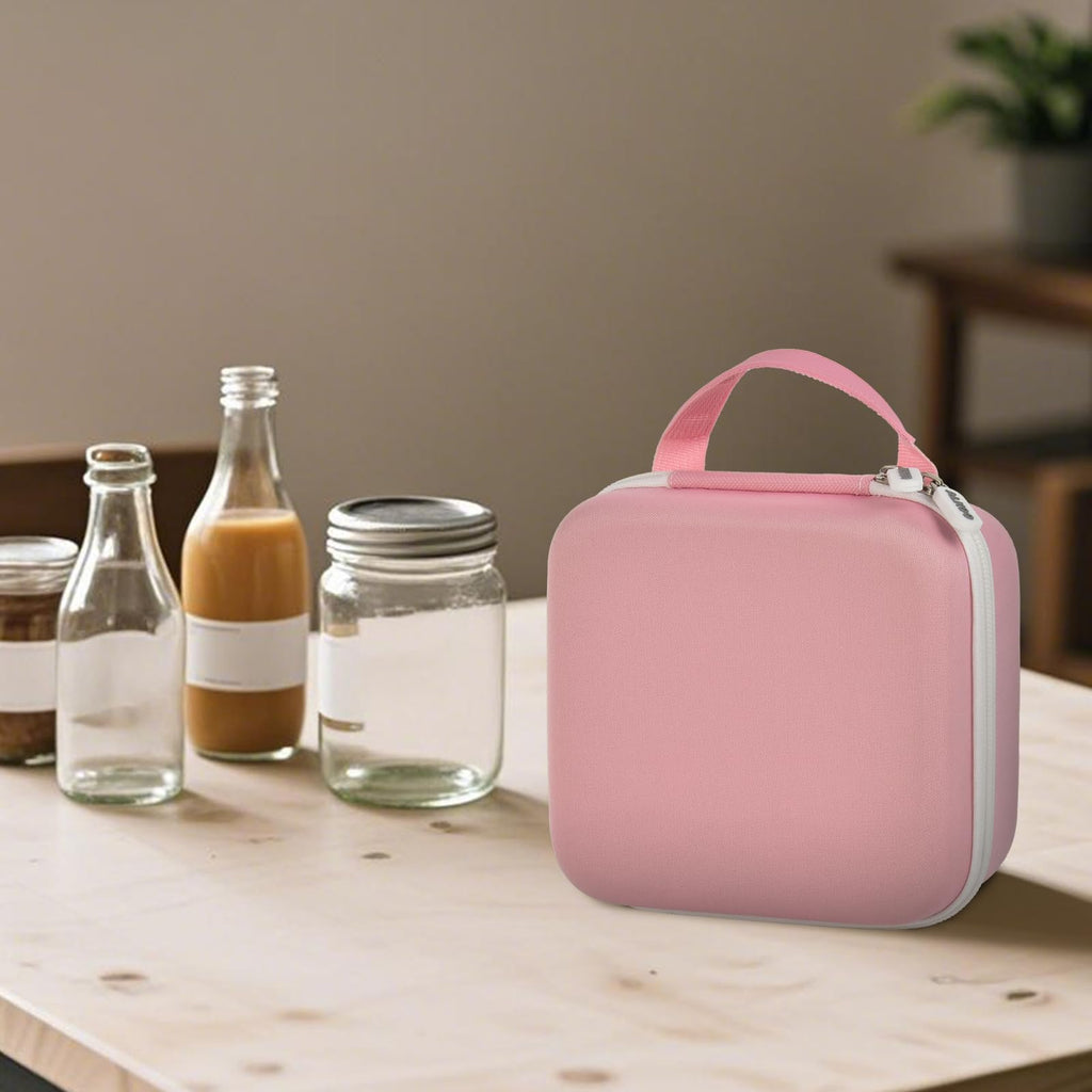 Person carrying the pink for NIIMBOT label maker case by its top handle