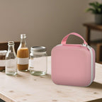Person carrying the pink for NIIMBOT label maker case by its top handle