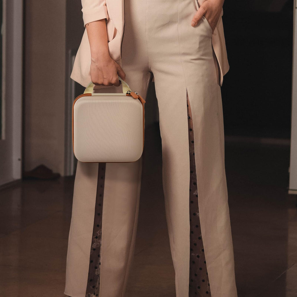 Person carrying the beige for NIIMBOT label maker case by its top handle