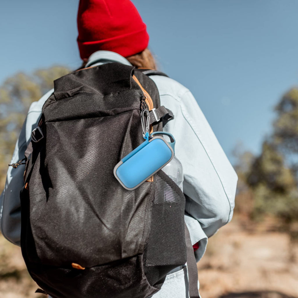 Blue for KardiaMobile case clipped to a hiking backpack