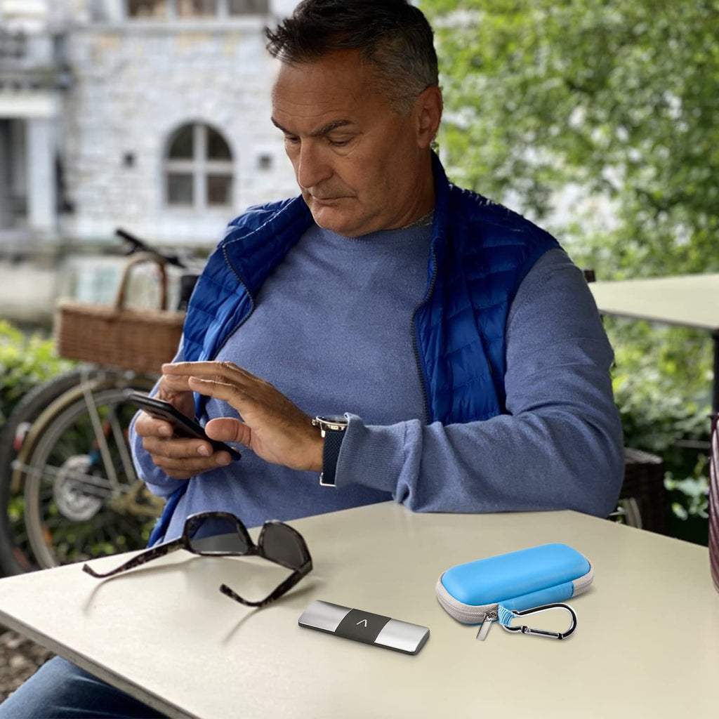 Man using a for KardiaMobile device beside the open blue travel case