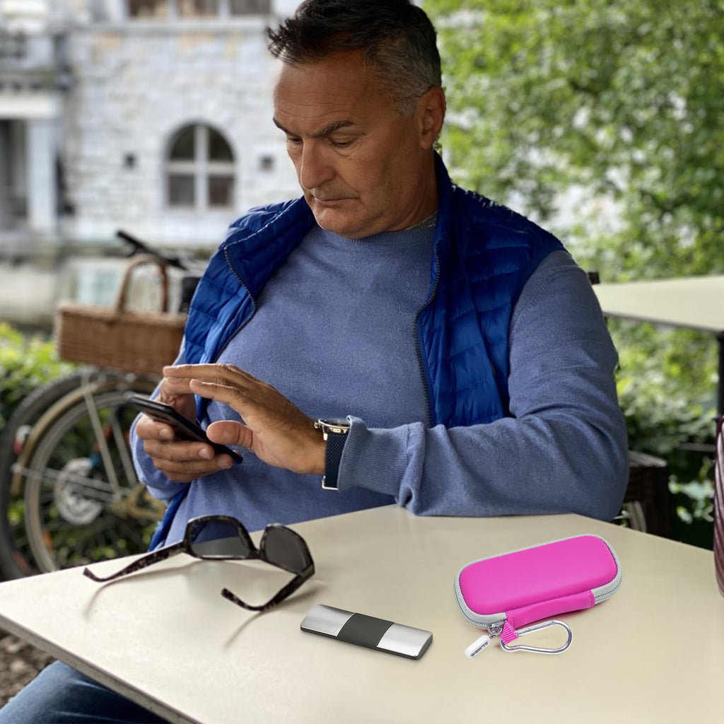 Man using a for KardiaMobile device beside the open pink travel case