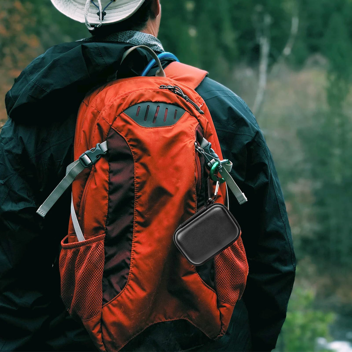 Black for Crucial SSD case clipped to a hiking backpack