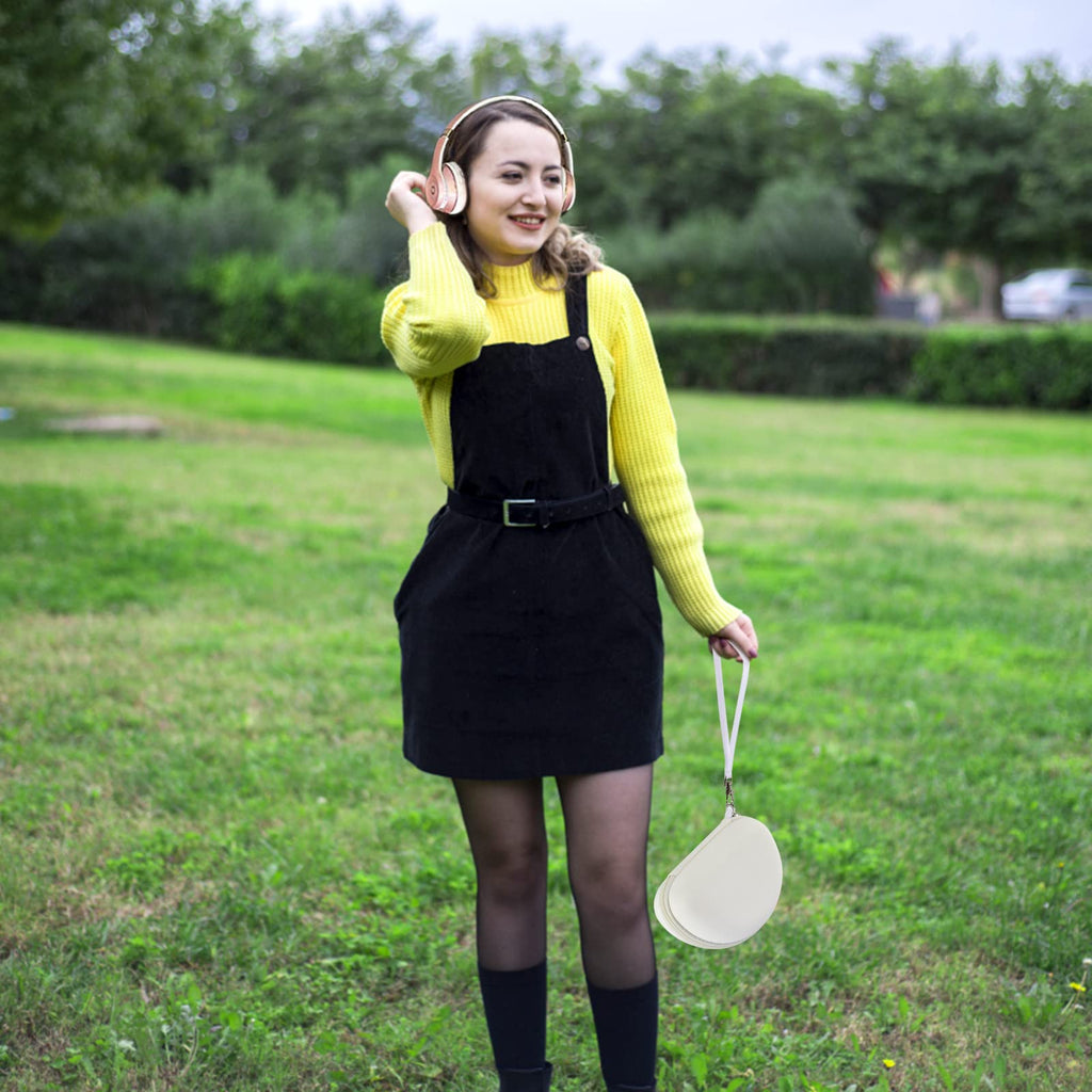 Woman carrying the white headphone case by its wrist strap