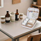 Open white and tan for NIIMBOT label maker organizer beside bottles and jars