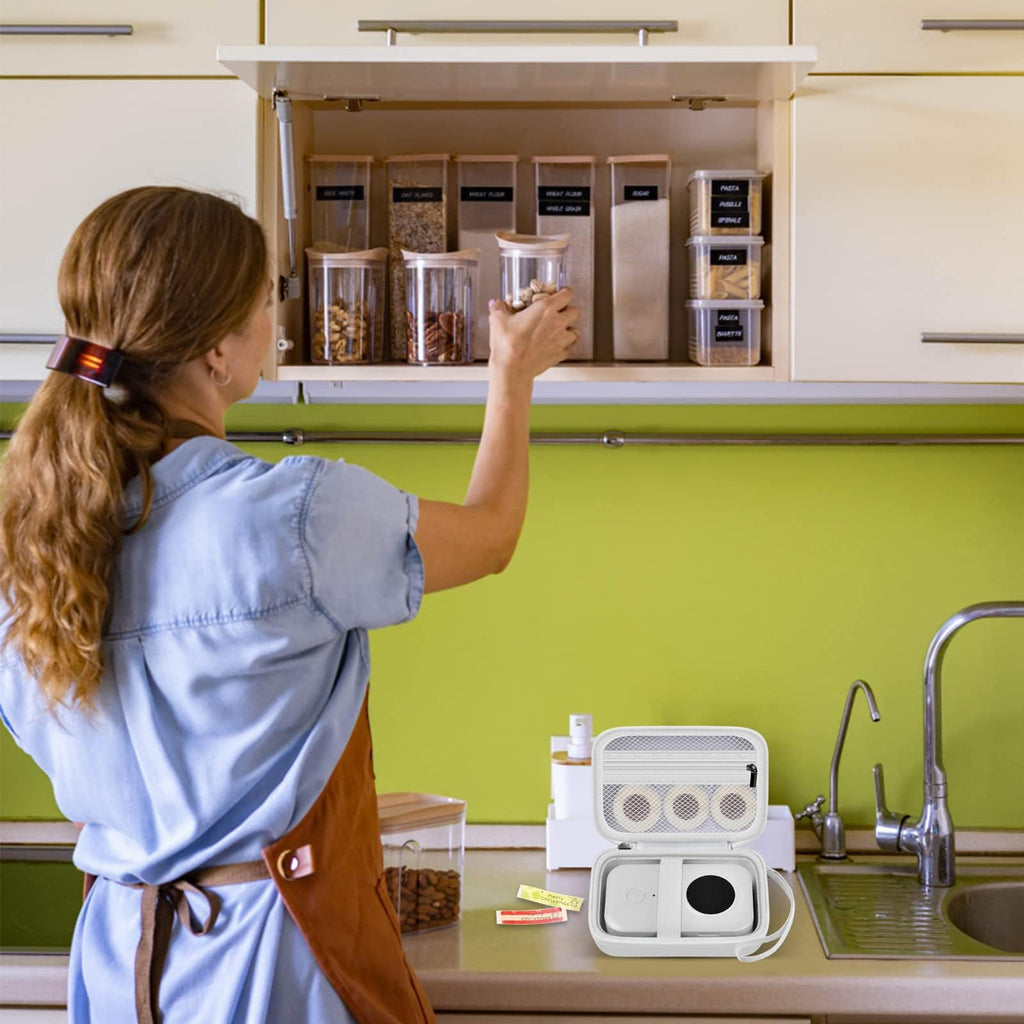 White label maker case beside a mini printer in a kitchen organization scene
