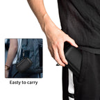 Person carrying the black SSD case by its carabiner