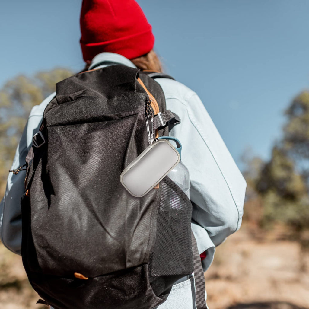 White for KardiaMobile case clipped to a hiking backpack
