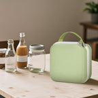 Closed light green for NIIMBOT label maker case beside bottles and jars