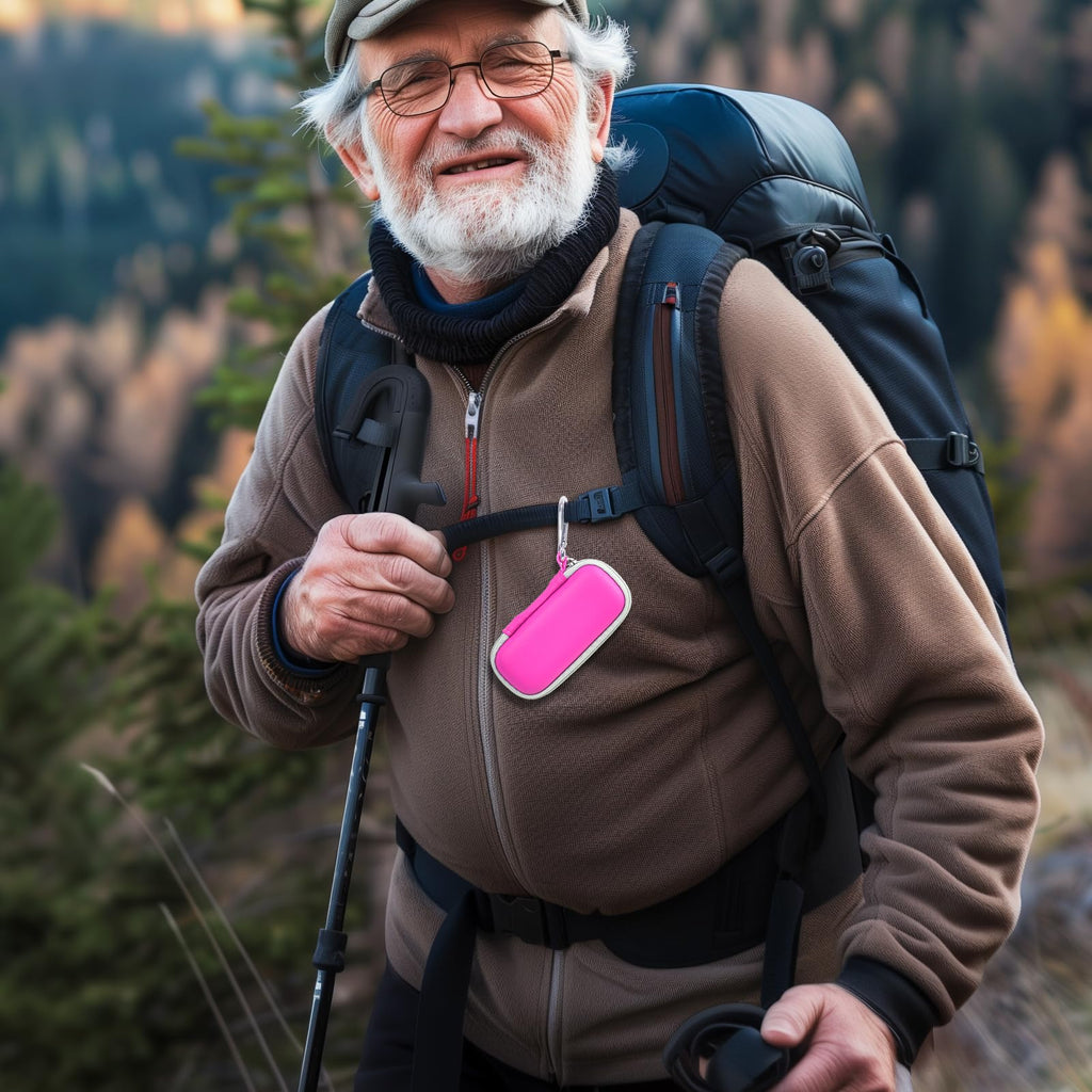 Man checking heart rhythm results beside the open pink for KardiaMobile organizer