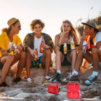 Friends using a for JBL Go speaker with the open red travel case at the beach