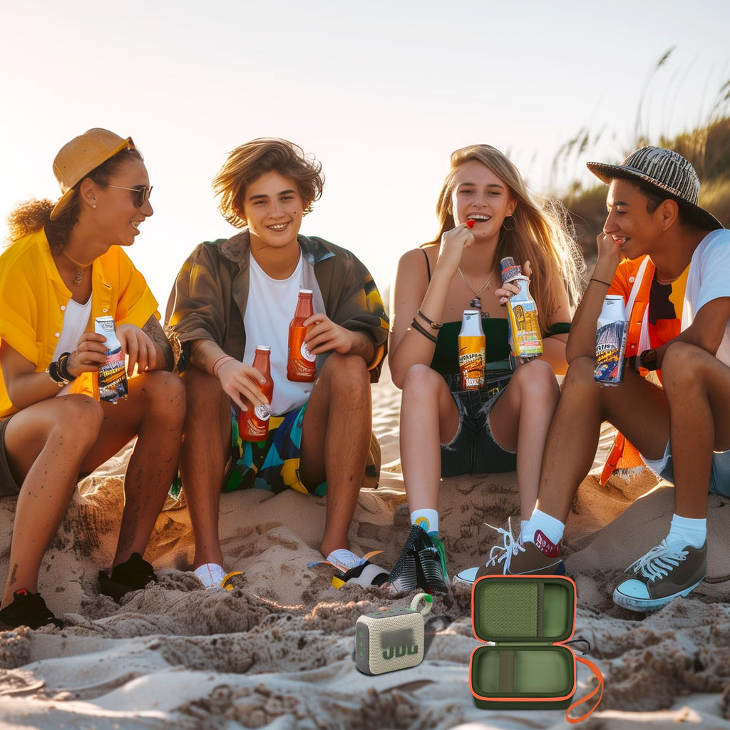 Friends using a for JBL Go speaker with the open dark green and orange travel case at the beach