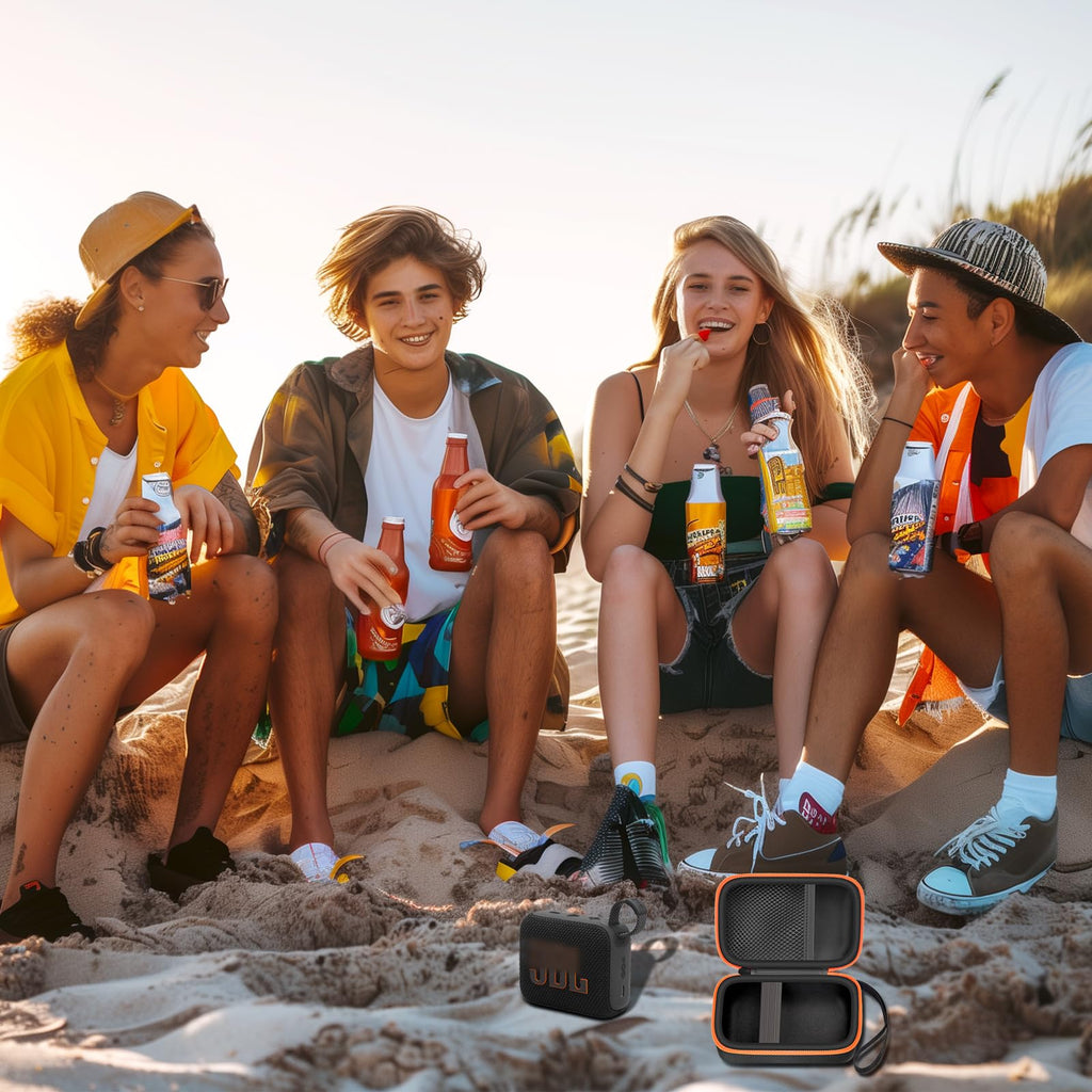Friends using a for JBL Go speaker with the open black and orange travel case at the beach