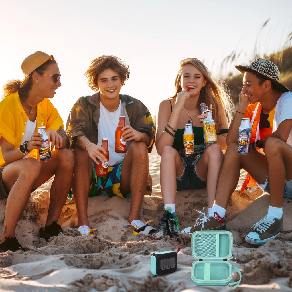 Friends using a for JBL Go speaker with the open mint green travel case at the beach