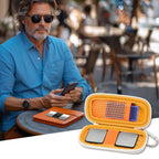Man checking heart rhythm results beside the open orange for KardiaMobile organizer