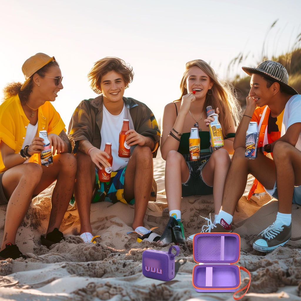Friends using a for JBL Go speaker with the open purple and orange travel case at the beach
